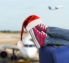 Airport traveler with Santa hat 