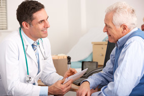 Doctor sitting with patient