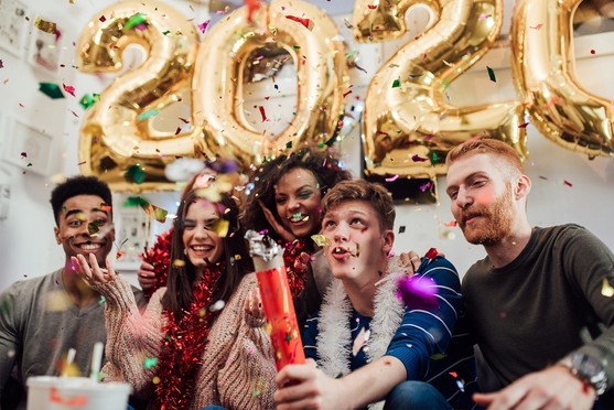 People Celebrating 2020 New Year with Confetti 