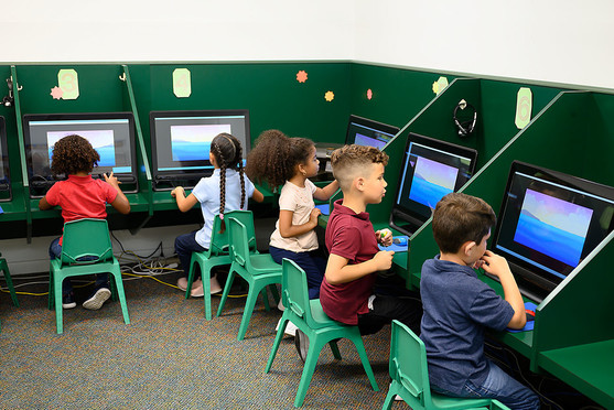 Children sitting at computers