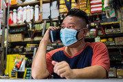 Man in a warehouse wearing a mask