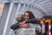 Veteran hugging a smiling young woman