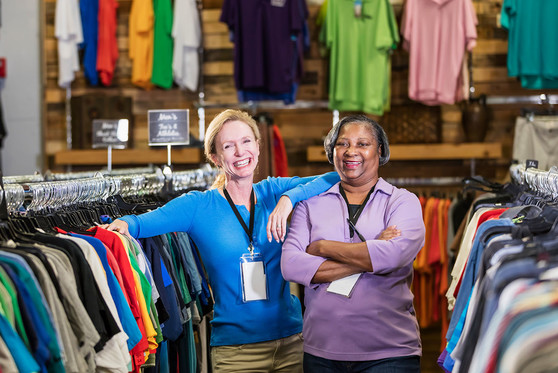 Two female staffers working at a clothing store