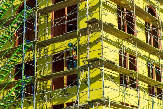 A new apartment building surrounded by scaffolding