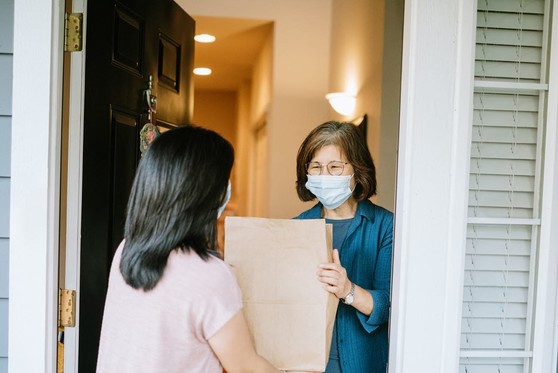 Asian women wearing face masks in a house