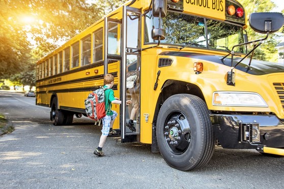 Children boarding a school bus