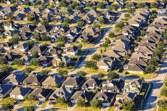 An aerial view of a neighborhood with several blocks of houses