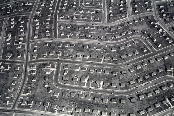 An aerial view of several blocks of houses