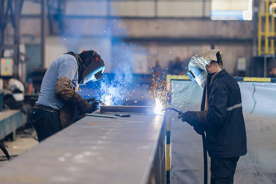 Welders working in a workshop