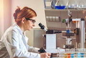 A female scientists works on a project in a lab.