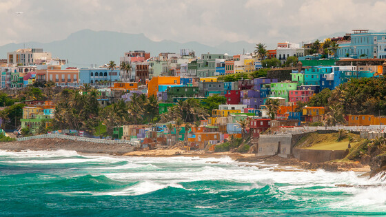 Colorful houses built on tiers overlooking the ocean in Puerto Rico.