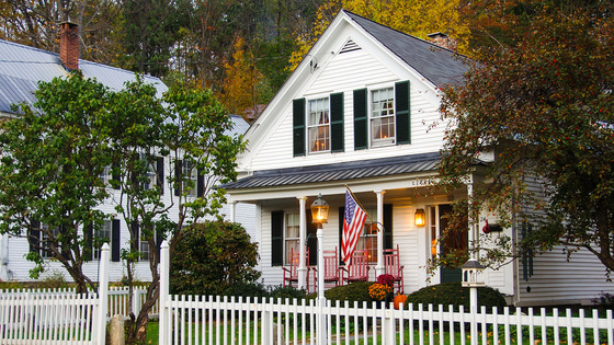 House with fence and American flag 