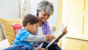 Grandmother and grandchild read together 