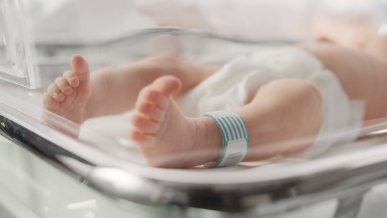 infant in incubator