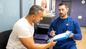 Doctor and patient in conversation in medical facility