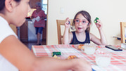 Parent and child have meal at home