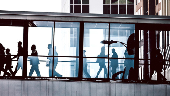 Pedestrians on an elevated walkway.