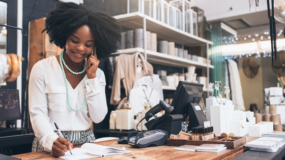 Employee talks on phone in retail store