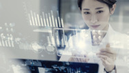 A person interacts with an interface filled with data visualizations.