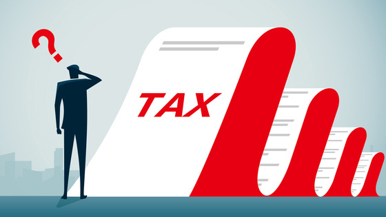 A figure looks at a tax document marked “Tax.”