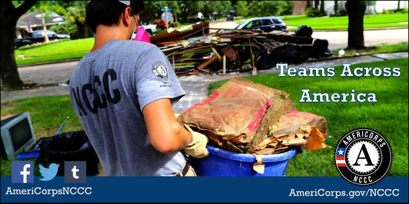 Corps member removing debris