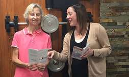 Oswego County, NY, Retired and Senior Volunteer Program Director Meave Gillen (right) speaks with volunteer Linda Hall about an RSVP initiative.