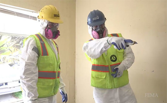 AmeriCorps members muck and gut homes in Texas damaged by Hurricane Harvey.
