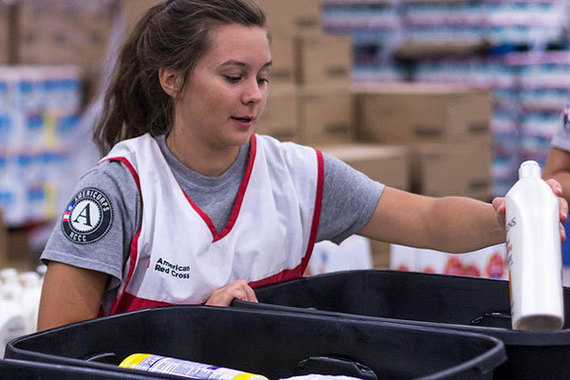 An AmeriCorps NCCC member serving with the American Red Cross sorts supplies for Hurricane Harvey survivors in Texas.