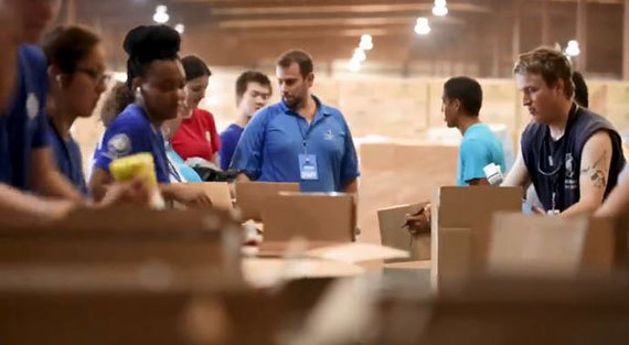 Volunteers assemble boxes of supplies to help hurricane survivors in Puerto Rico.