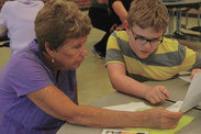Jasper County Senior Corps RSVP volunteers have formed a bond with third graders at an Iowa elementary school Write to Read program.