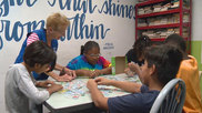 A Senior Corps Foster Grandparent volunteer helps out at the Waco Boys & Girls Club in Texas.