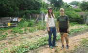 AmeriCorps member Taylor Thorp and North Hills Community Outreach coordinator Alyssa Crawford tend to a Bellevue green space to stock food pantries.