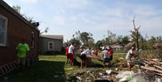 Local volunteers help with cleanup after a tornado struck Marshalltown, Iowa. (Des Moines Register photo) 