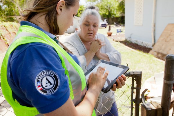 AmeriCorps member assisting hurricane victim