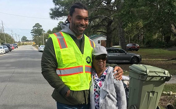 Carolina Panthers' Julius Peppers meets homeowner Helen Hayes while her home was being mucked and gutted by AmeriCorps and United Way volunteers.