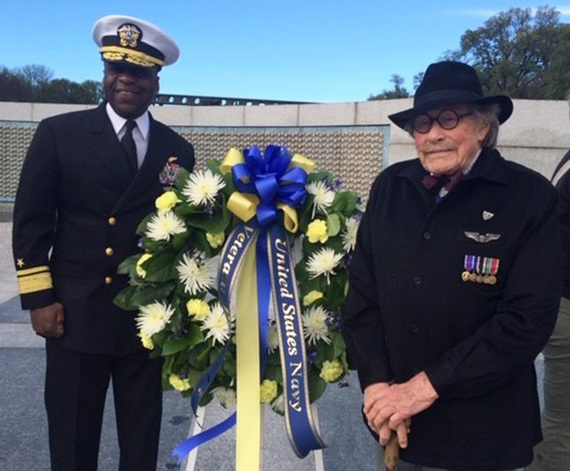 Admiral Earl L. Gay stands with World War II veteran Ewing H. Miller, a U.S. Air Force veteran who flew over 20 missions during the war.