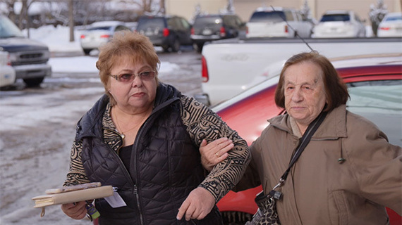 Neli Rubinov (left) helps 86-year-old Doba Skomarovskaya’s run her weekly errands as a Senior Companion volunteer.