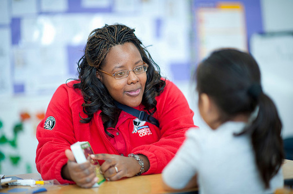 An AmeriCorps Reading Corps tutor works with a student during a one-on-one training session.