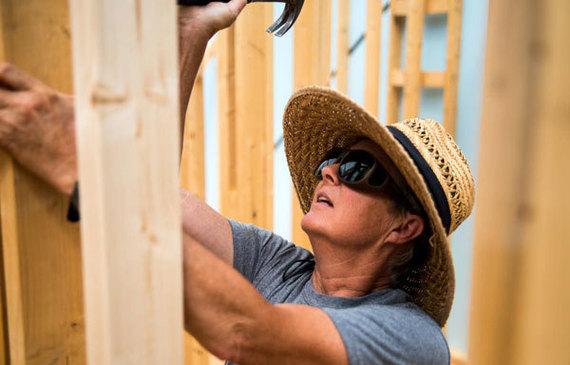 Women work together to demonstrate their construction skills during Habitat for Humanity projects.