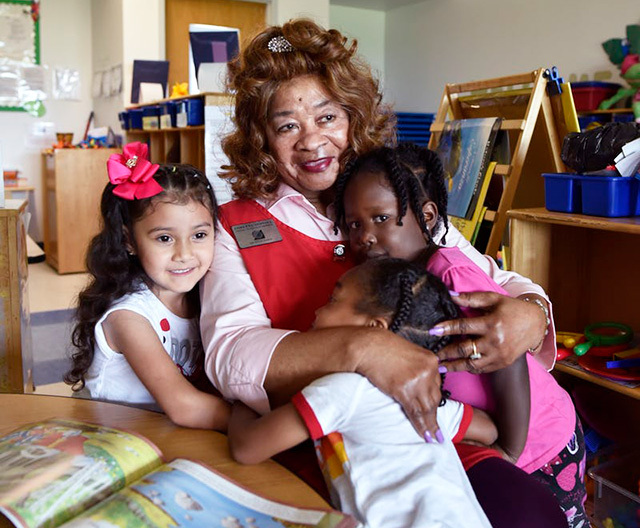Senior Corps Foster Grandparent Loretta Stovall, 84, gets goodbye hugs at the end of her day at a Head Start center in Dallas.  (Photo by Ben Torres)