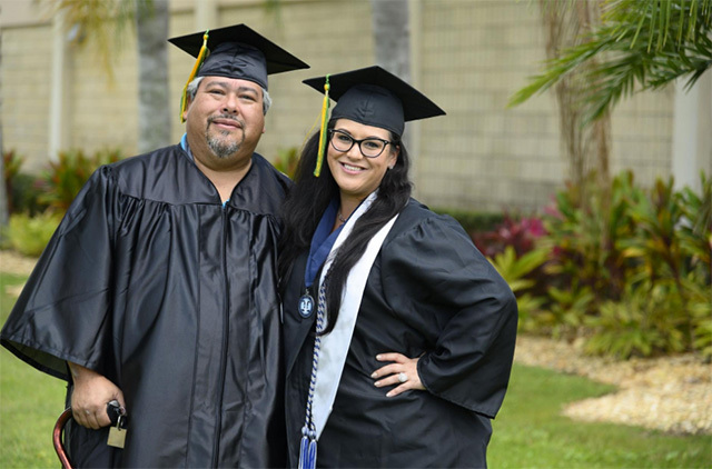 Frederick '"Roy" Sosa and his daughter, Tiffany Anderson, pose after receiving their degrees in psychology at Saint Leo University in Florida. 