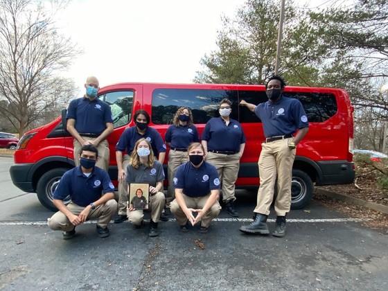 FEMA Corps team posing in front of team van