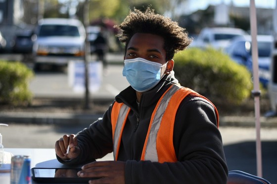 Member sitting at a table at a mass vaccination site