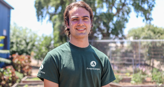 AmeriCorps team leader serving in the NCCC program smiling to camera outdoors