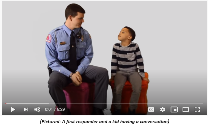 A first responder and a kid having a conversation