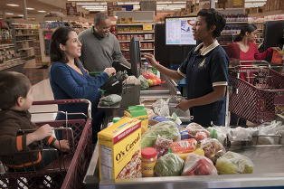 Image of family at supermarket checkout