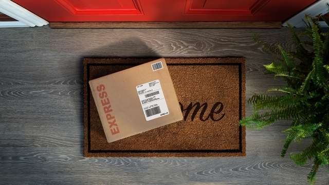 Package on Welcome doormat