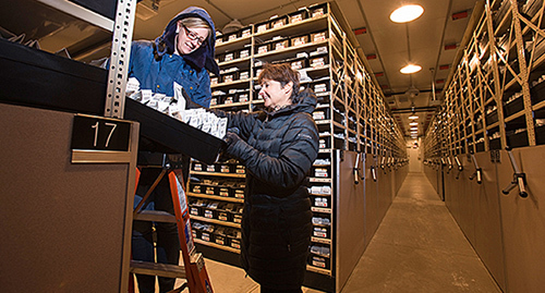 Researchers in a cold vault.