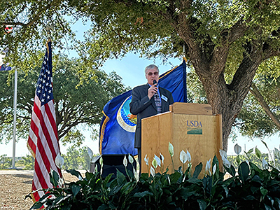 	Dr. Steven Kappes, ARS Associate Administrator, at a podium during the ribbon cutting ceremony.