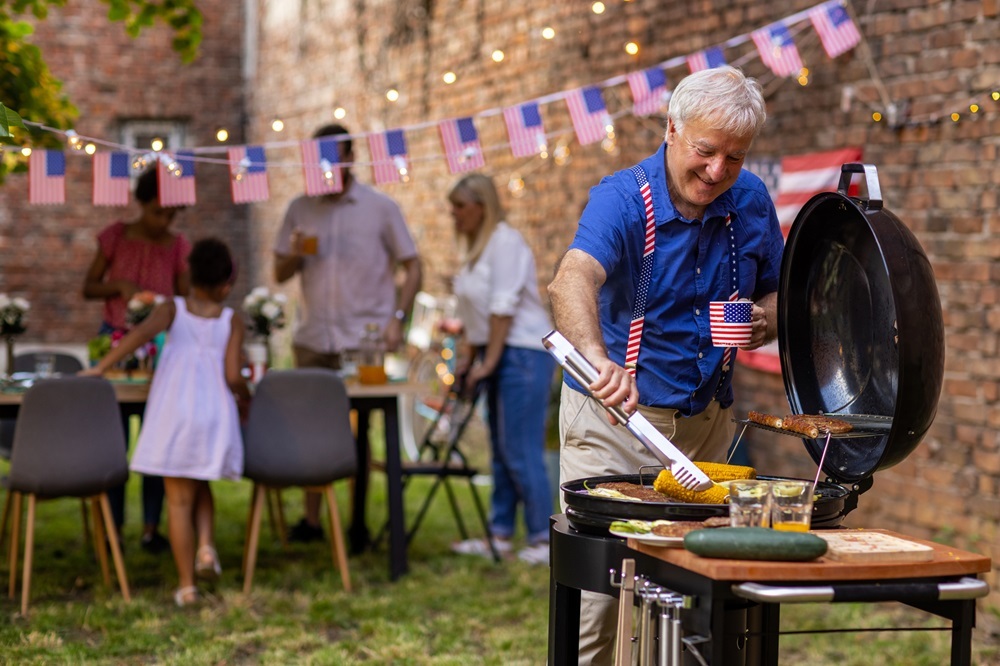 Preparing barbeque for American national holiday in a backyard, (Getty stock photo)